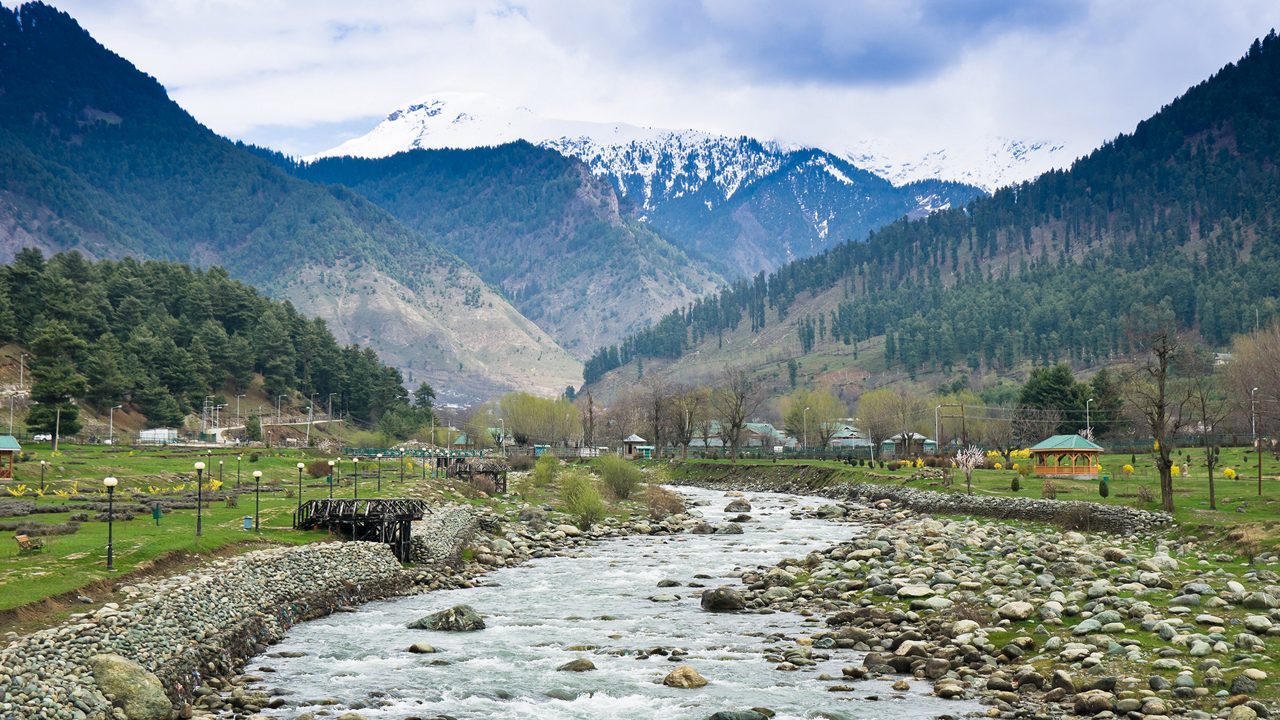 Green meadow and peaks around Pahalgam